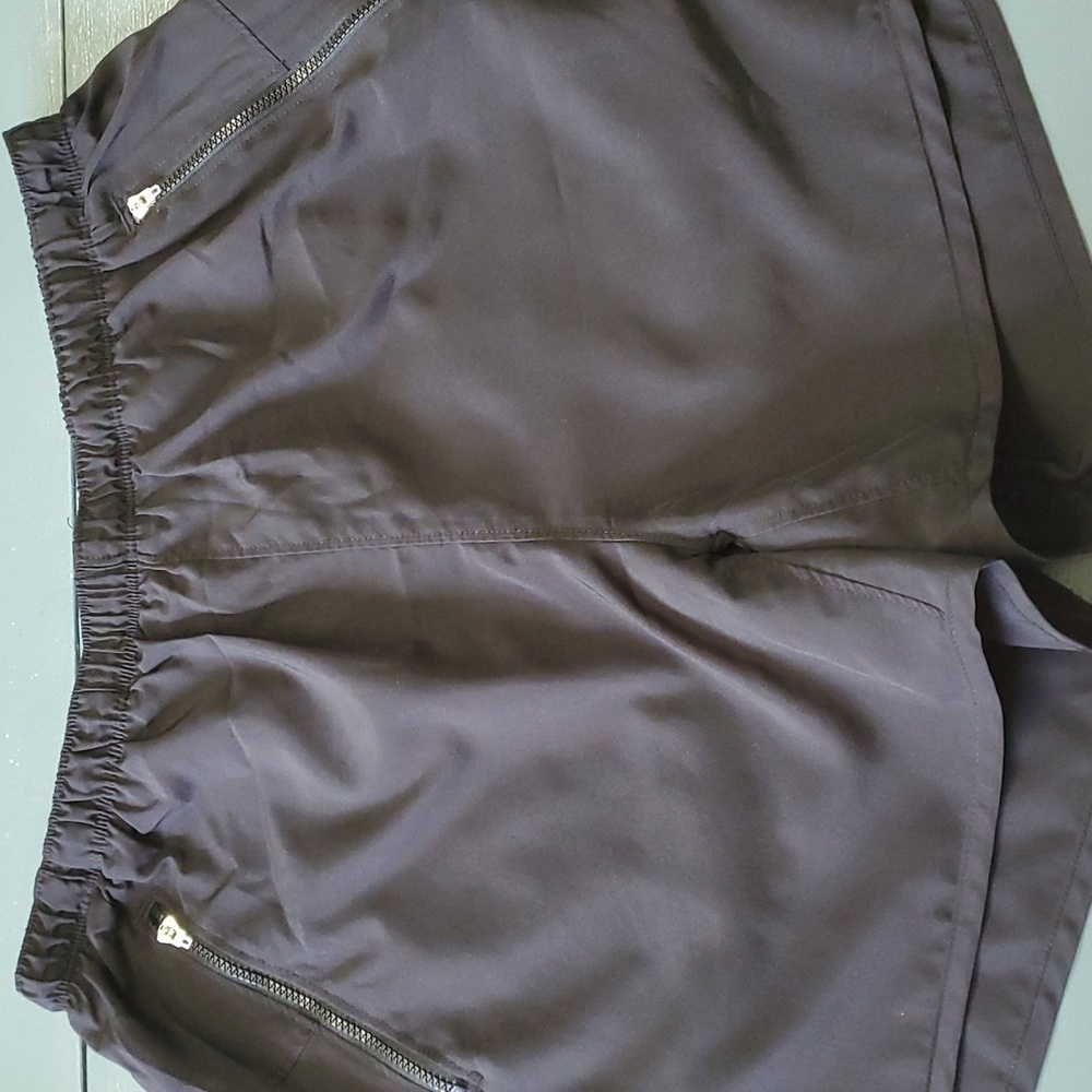 Chapman women's black polyester shorts. 2 zipper pocket.  Elastic waist with tie